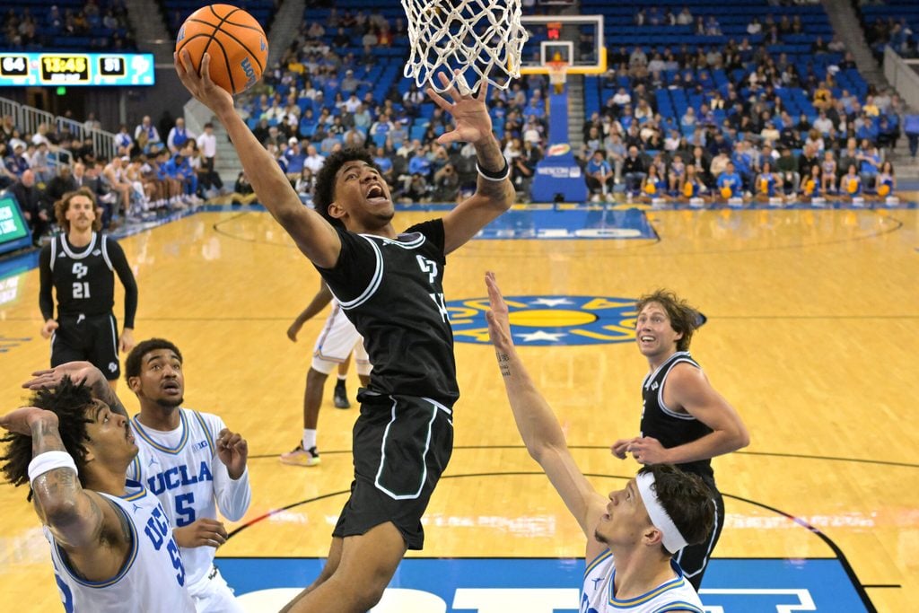 Dec 19, 2025; Los Angeles, California, USA; Cal Poly Mustangs guard Cayden Ward (14) goes up for a basket during the second half against the UCLA Bruins at Pauley Pavilion presented by Wescom Financial. Mandatory Credit: Jayne Kamin-Oncea-Imagn Images