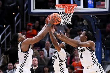 Dec 20, 2025; Indianapolis, Indiana, USA; Butler Bulldogs forward Michael Ajayi (5) and Butler Bulldogs guard Azavier Robinson (23) go for a rebound during the second half against the Northwestern Wildcats at Gainbridge Fieldhouse. Mandatory Credit: Robert Goddin-Imagn Images
