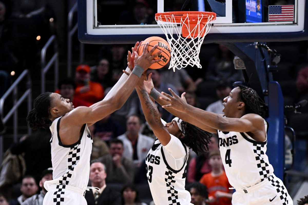Dec 20, 2025; Indianapolis, Indiana, USA; Butler Bulldogs forward Michael Ajayi (5) and Butler Bulldogs guard Azavier Robinson (23) go for a rebound during the second half against the Northwestern Wildcats at Gainbridge Fieldhouse. Mandatory Credit: Robert Goddin-Imagn Images