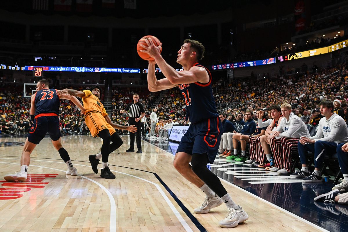 Dec 20, 2025; Iowa City, Iowa, USA; Bucknell Bison guard Achile Spadone (24) shoots a three-point basket against the Iowa Hawkeyes during the second half at Casey’s Center. Mandatory Credit: Jeffrey Becker-Imagn Images