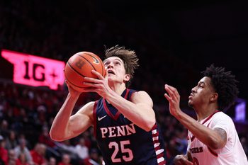 Dec 20, 2025; Piscataway, New Jersey, USA; Penn Quakers forward Augustus Gerhart (25) goes to the basket against the Rutgers Scarlet Knights during the first half at Jersey Mike's Arena. Mandatory Credit: Vincent Carchietta-Imagn Images