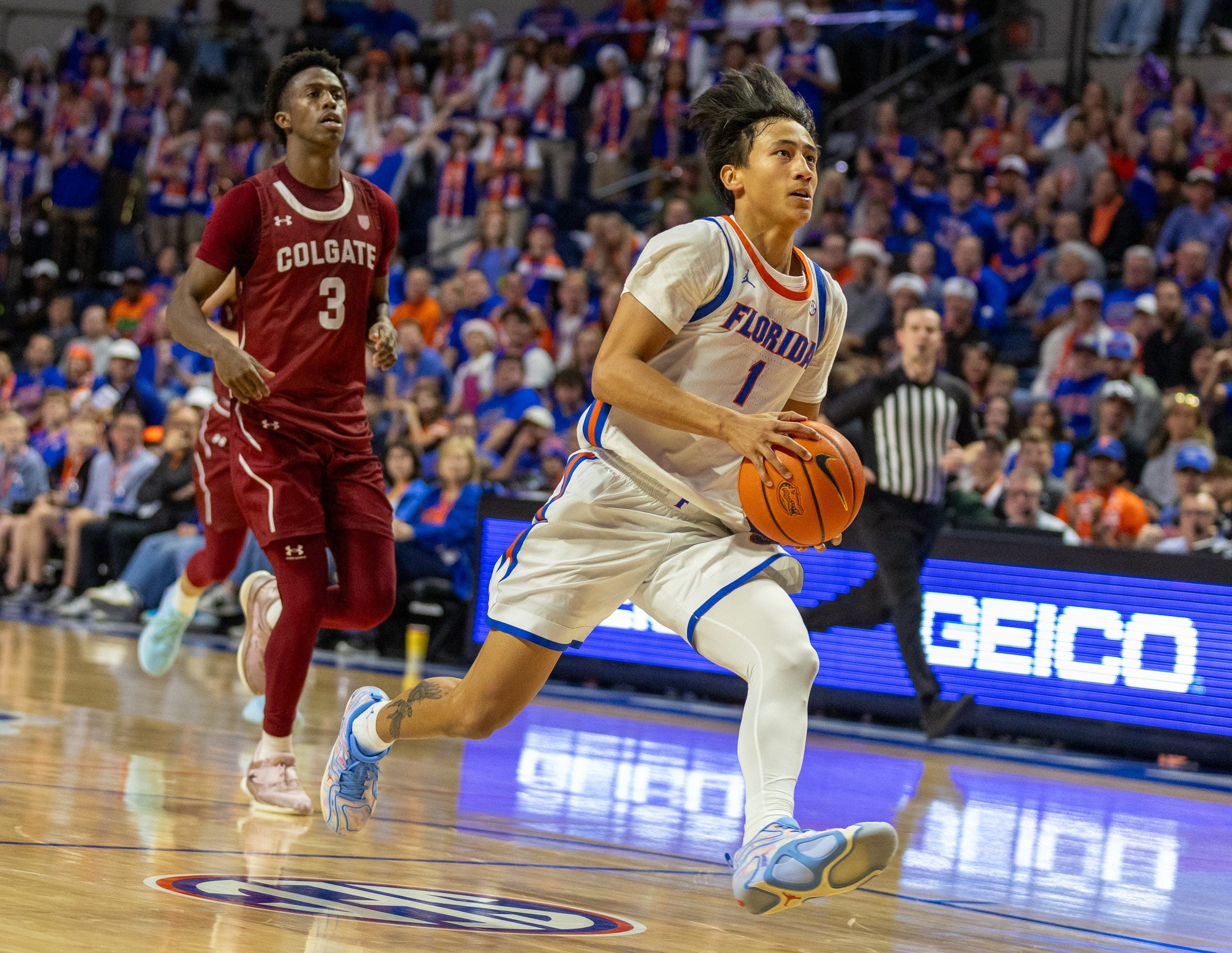 Florida guard Xaivian Lee (1) drives for the basket during the second half of an NCAA mens basketball game at Steven C. O'Connell Center Exactek arena in Gainesville, FL on Sunday, December 21, 2025. Florida won 90-60. [Alan Youngblood/Gainesville Sun]