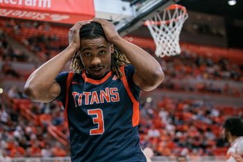 Dec 21, 2025; Stillwater, Oklahoma, USA; Cal State Fullerton Titans guard Joshua Ward (3) reacts after a play during the second half against the Oklahoma State Cowboys at Gallagher-Iba Arena. Mandatory Credit: William Purnell-Imagn Images