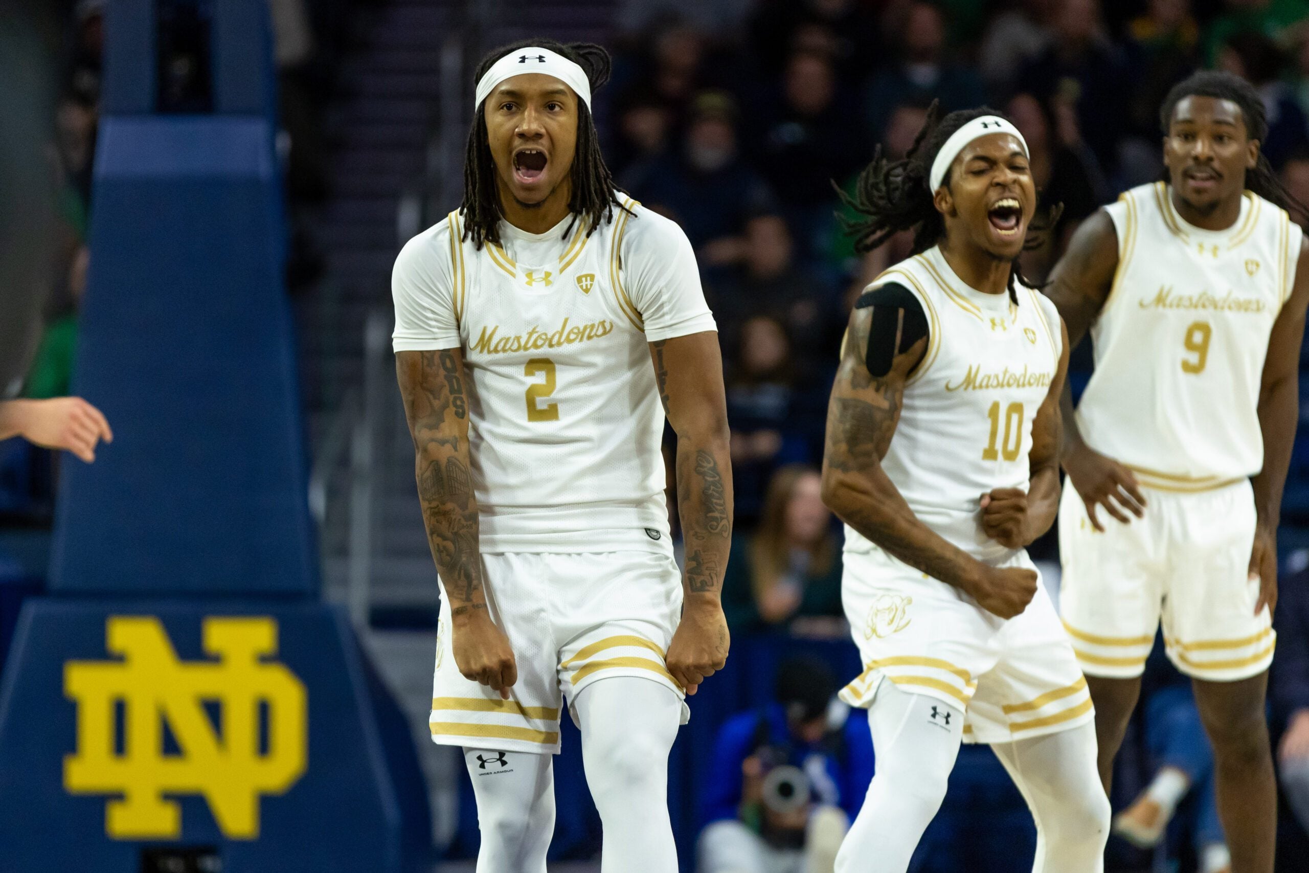 Dec 21, 2025; South Bend, Indiana, USA; Purdue Fort Wayne Mastodons guard Mikale Stevenson (2) and Purdue Fort Wayne Mastodons guard Corey Hadnot II (10) celebrate against the Notre Dame Fighting Irish during the second half at Purcell Pavilion at the Joyce Center. Mandatory Credit: Michael Caterina-Imagn Images
