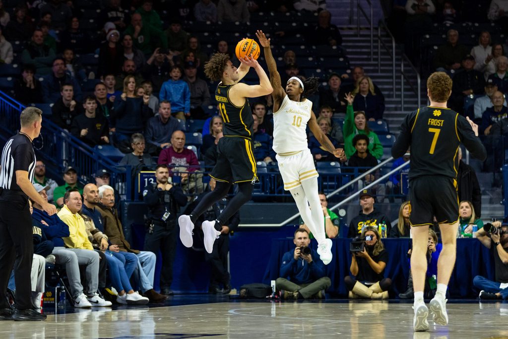 Dec 21, 2025; South Bend, Indiana, USA; Notre Dame Fighting Irish guard Braeden Shrewsberry (11) puts up a shot as Purdue Fort Wayne Mastodons guard Corey Hadnot II (10) defends during the second half at Purcell Pavilion at the Joyce Center. Mandatory Credit: Michael Caterina-Imagn Images