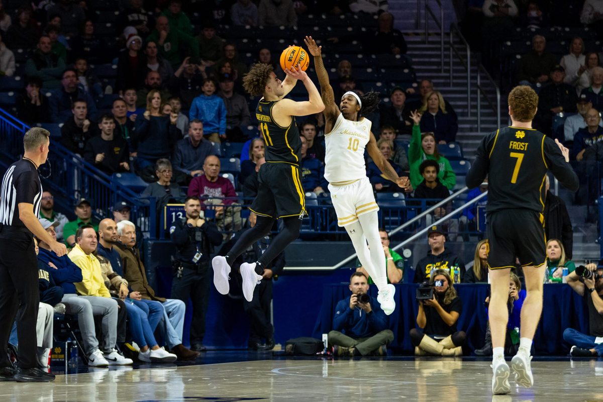 Dec 21, 2025; South Bend, Indiana, USA; Notre Dame Fighting Irish guard Braeden Shrewsberry (11) puts up a shot as Purdue Fort Wayne Mastodons guard Corey Hadnot II (10) defends during the second half at Purcell Pavilion at the Joyce Center. Mandatory Credit: Michael Caterina-Imagn Images