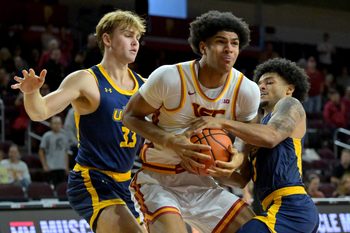 Dec 21, 2025; Los Angeles, California, USA; USC Trojans forward Jacob Cofie (6), UC Santa Cruz Banana Slugs wing Caden Breznikar (33) and guard Elijah Brooks (3) battle for a rebound in the first half at Galen Center. Mandatory Credit: Jayne Kamin-Oncea-Imagn Images