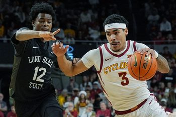 Iowa State Cyclones guard Tamin Lipsey (3) drives with the ball around Long Beach State guard Isaiah Lewis (12) during the first half in the NCAA men’s basketball on Dec. 21, 2025, at Hilton Coliseum in Ames, Iowa.