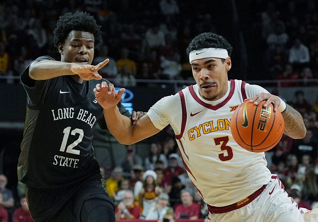 Iowa State Cyclones guard Tamin Lipsey (3) drives with the ball around Long Beach State guard Isaiah Lewis (12) during the first half in the NCAA men’s basketball on Dec. 21, 2025, at Hilton Coliseum in Ames, Iowa.