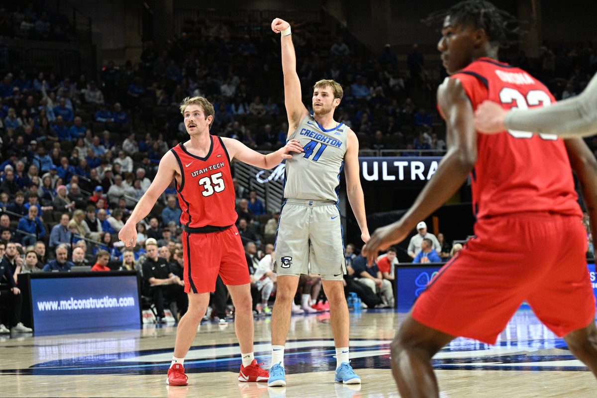 Dec 22, 2025; Omaha, Nebraska, USA;  Creighton Bluejays forward Isaac Traudt (41) watches a three point basket fall against Utah Tech Trailblazers forward Ethan Potter (35) during the second half at CHI Health Center Omaha. Mandatory Credit: Steven Branscombe-Imagn Images