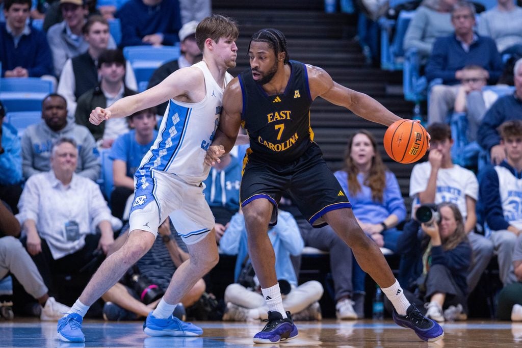 Dec 22, 2025; Chapel Hill, North Carolina, USA; East Carolina Pirates center Giovanni Emejuru (7) backs down on North Carolina Tar Heels center Henri Veesaar (13) during the second half at Dean E. Smith Center. Mandatory Credit: Scott Kinser-Imagn Images