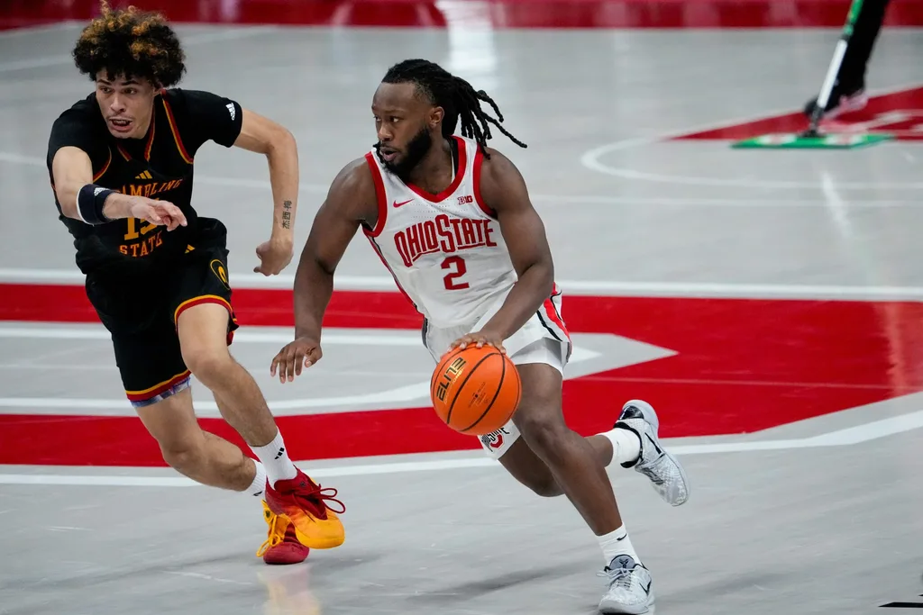 Ohio State Buckeyes guard Bruce Thornton (2) dribbles the ball against Grambling State Tigers forward Antonio Munoz (15) in the second half of the NCAA men’s basketball game Value City Arena on Tuesday, Dec. 23, 2025 in Columbus, Ohio.