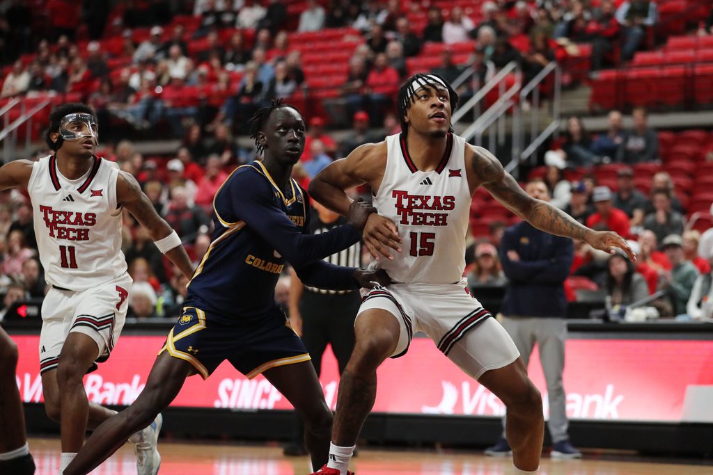 Dec 16, 2025; Lubbock, Texas, USA; Texas Tech Red Raiders forward JT Toppin (15) blocks out Northern Colorado Bears guard Ariik Mawien (3) in the second half at United Supermarkets Arena. Mandatory Credit: Michael C. Johnson-Imagn Images