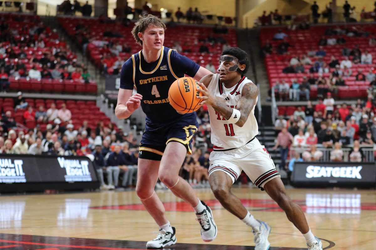 Dec 16, 2025; Lubbock, Texas, USA; Texas Tech Red Raiders guard Jaylen Petty (11) drives to the basket against Northern Colorado Bears center Hunter Caldwell (4) in the second half at United Supermarkets Arena. Mandatory Credit: Michael C. Johnson-Imagn Images
