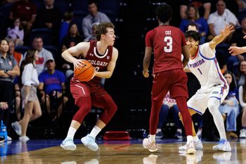 Dec 21, 2025; Gainesville, Florida, USA; Colgate Raiders guard Kyle Carlesimo (13) looks to pass while Colgate Raiders guard Jalen Cox (3) screens Florida Gators guard Xaivian Lee (1) during the second half at Exactech Arena at the Stephen C. O'Connell Center. Mandatory Credit: Matt Pendleton-Imagn Images