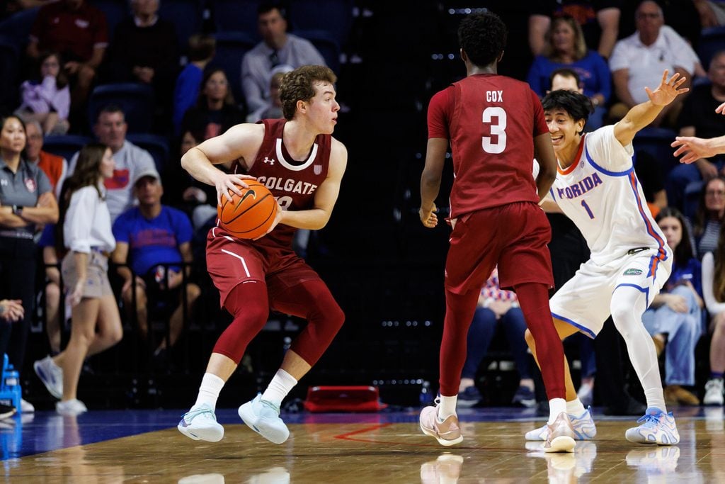 Dec 21, 2025; Gainesville, Florida, USA; Colgate Raiders guard Kyle Carlesimo (13) looks to pass while Colgate Raiders guard Jalen Cox (3) screens Florida Gators guard Xaivian Lee (1) during the second half at Exactech Arena at the Stephen C. O'Connell Center. Mandatory Credit: Matt Pendleton-Imagn Images