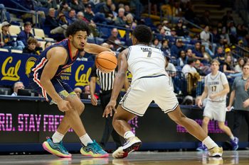 Dec 19, 2025; Berkeley, California, USA; Morgan State Bears guard Alfred Worrell Jr. (1) dribbles the ball against California Golden Bears guard Dai Dai Ames (7) during the second half at Haas Pavilion. Mandatory Credit: Robert Edwards-Imagn Images