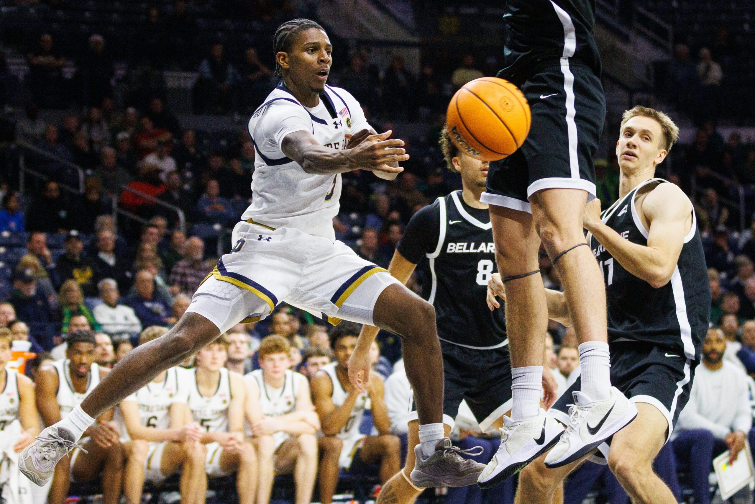 Notre Dame guard Markus Burton, left, passes the ball during a NCAA men's basketball game against Bellarmine at Purcell Pavilion on Wednesday, Nov. 19, 2025, in South Bend.
