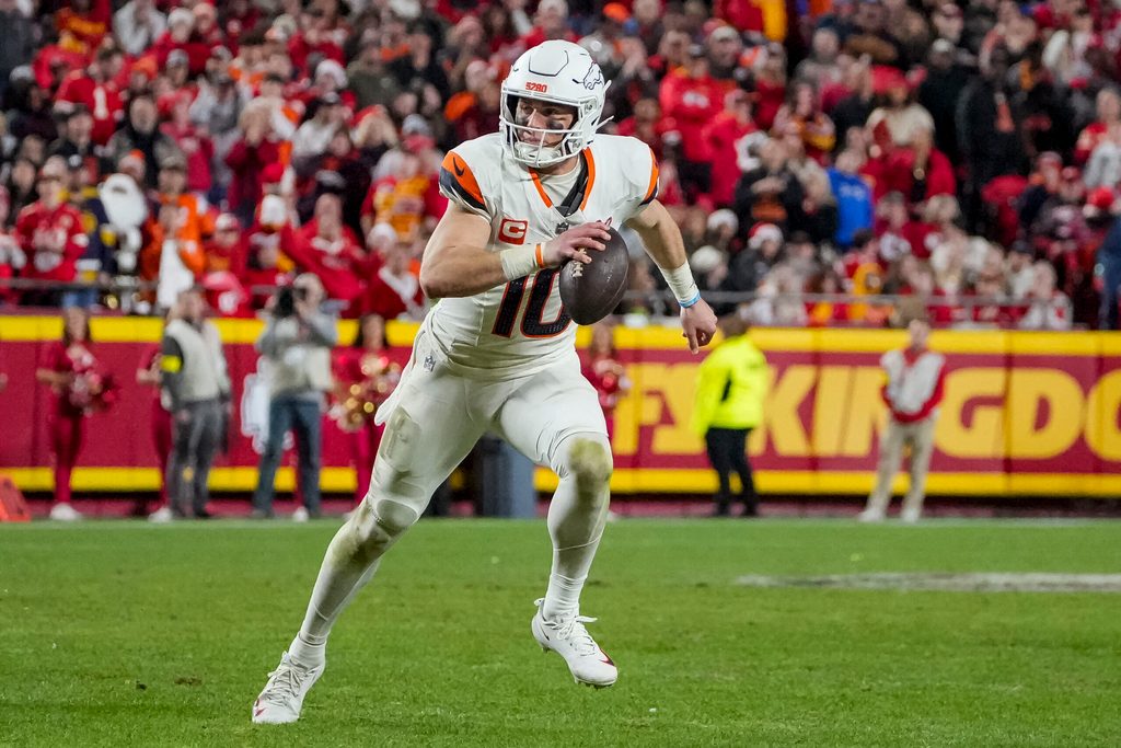 Dec 25, 2025; Kansas City, Missouri, USA; Denver Broncos quarterback Bo Nix (10) runs the ball during the fourth quarter at GEHA Field at Arrowhead Stadium. Mandatory Credit: Denny Medley-Imagn Images