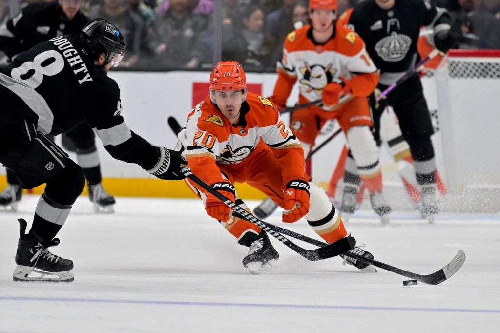 Dec 27, 2025; Los Angeles, California, USA; Anaheim Ducks left wing Chris Kreider (20) defends a shot on goal by Los Angeles Kings defenseman Drew Doughty (8) in the third period at Crypto.com Arena. Mandatory Credit: Jayne Kamin-Oncea-Imagn Images