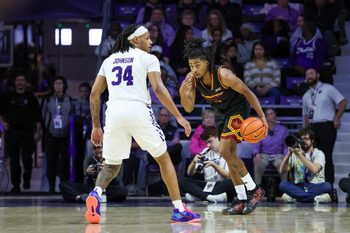 Dec 28, 2025; Manhattan, Kansas, USA; Louisiana-Monroe Warhawks guard Krystian Lewis (3) brings the ball up court against Kansas State Wildcats guard Nate Johnson (34) during the first half at Bramlage Coliseum. Mandatory Credit: Scott Sewell-Imagn Images