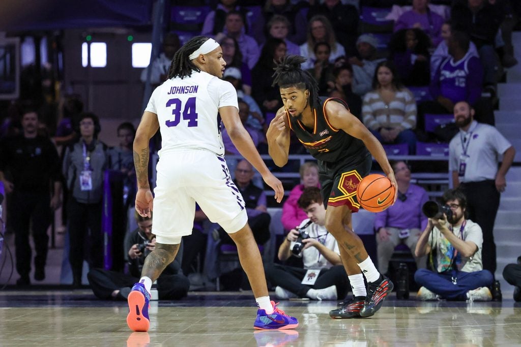Dec 28, 2025; Manhattan, Kansas, USA; Louisiana-Monroe Warhawks guard Krystian Lewis (3) brings the ball up court against Kansas State Wildcats guard Nate Johnson (34) during the first half at Bramlage Coliseum. Mandatory Credit: Scott Sewell-Imagn Images