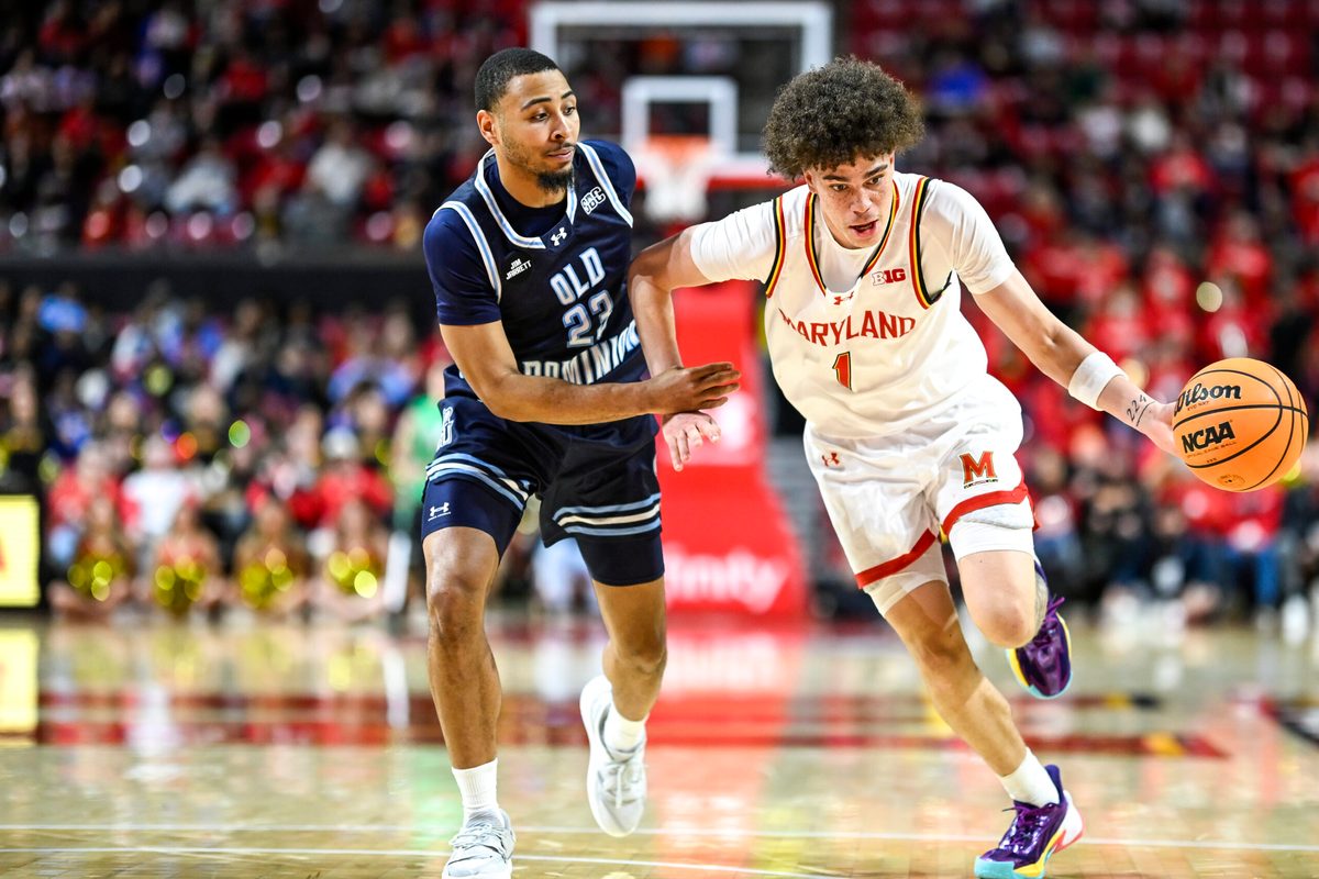 Dec 28, 2025; College Park, Maryland, USA; Maryland Terrapins guard Darius Adams (1) drives to the basket on Old Dominion Monarchs guard Jordan Battle (23) during the second half at Xfinity Center. Mandatory Credit: Tommy Gilligan-Imagn Images