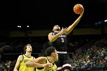 Dec 28, 2025; Eugene, Oregon, USA; Omaha Mavericks guard Grant Stubblefield (3) shoots the ball over Oregon Ducks guard Jackson Shelstad (3) during the second half at Matthew Knight Arena. Mandatory Credit: Craig Strobeck-Imagn Images