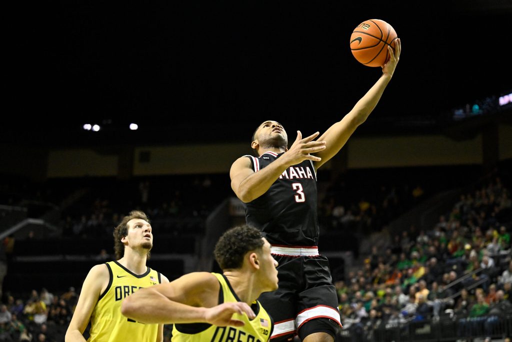 Dec 28, 2025; Eugene, Oregon, USA; Omaha Mavericks guard Grant Stubblefield (3) shoots the ball over Oregon Ducks guard Jackson Shelstad (3) during the second half at Matthew Knight Arena. Mandatory Credit: Craig Strobeck-Imagn Images