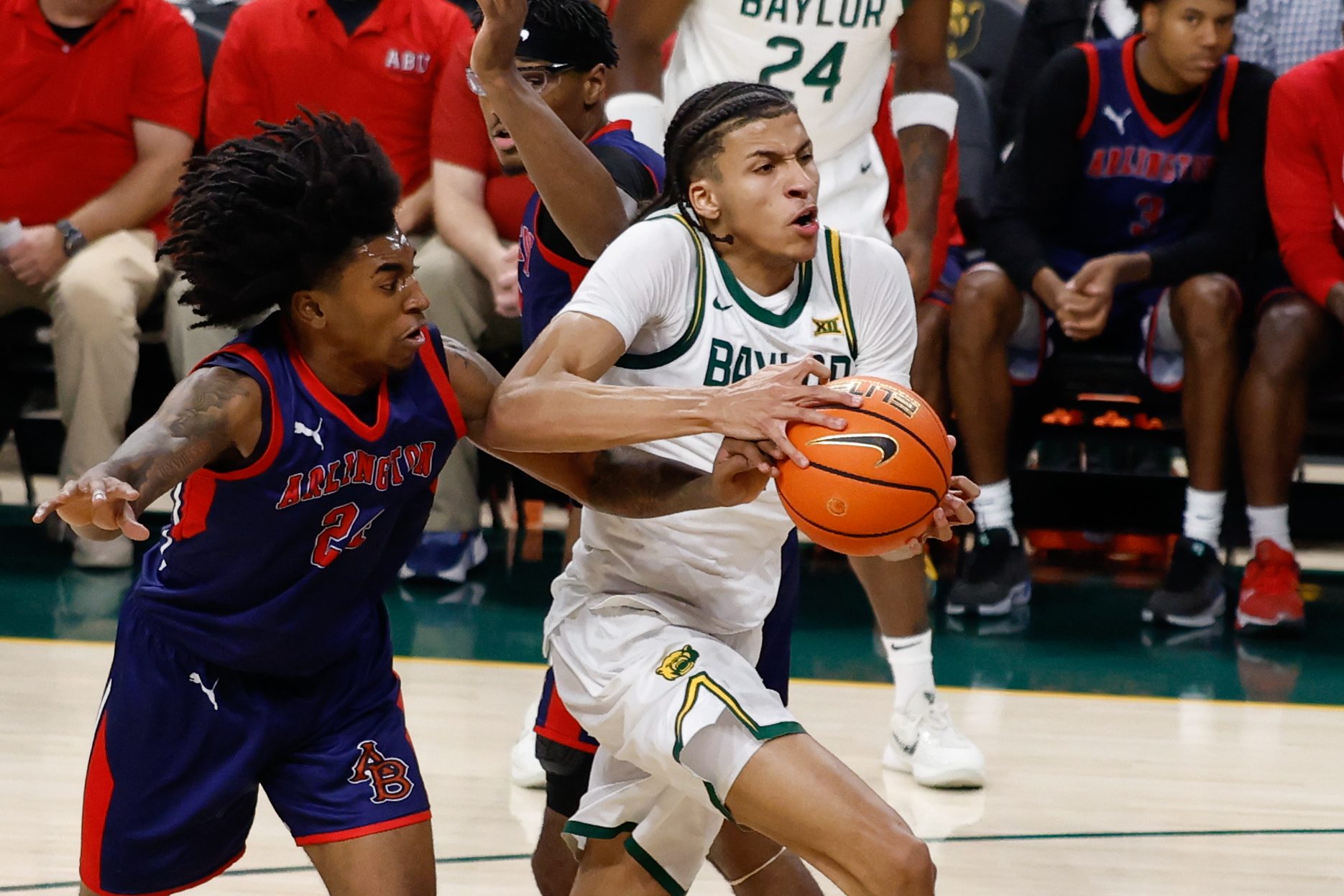 Dec 29, 2025; Waco, Texas, USA; Baylor Bears guard Cameron Carr (43) drives to the basket against Arlington Baptist Patriots guard Zion Bourgeois (24) during the first half at Paul and Alejandra Foster Pavilion. Mandatory Credit: Chris Jones-Imagn Images