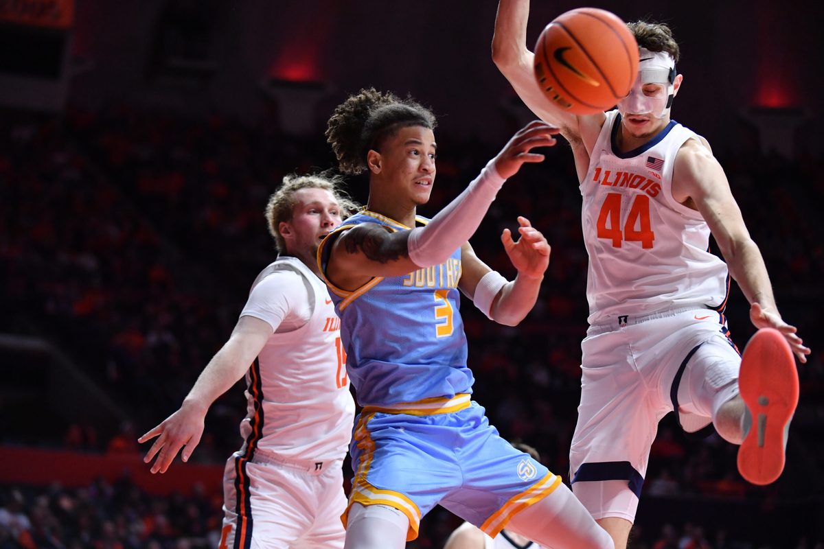 Dec 29, 2025; Champaign, Illinois, USA; Southern University Jaguars guard Cam Amboree (3) passes the ball by Illinois Fighting Illini forward Zvonimir Ivisic (44) during the second half at State Farm Center. Mandatory Credit: Ron Johnson-Imagn Images