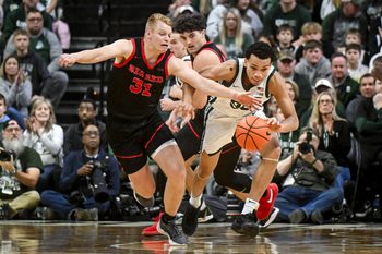Michigan State's Divine Ugochukwu, right, is pressured by Cornell's Cooper Noard during the first half on Monday, Dec. 29, 2025, at the Breslin Center in East Lansing.
