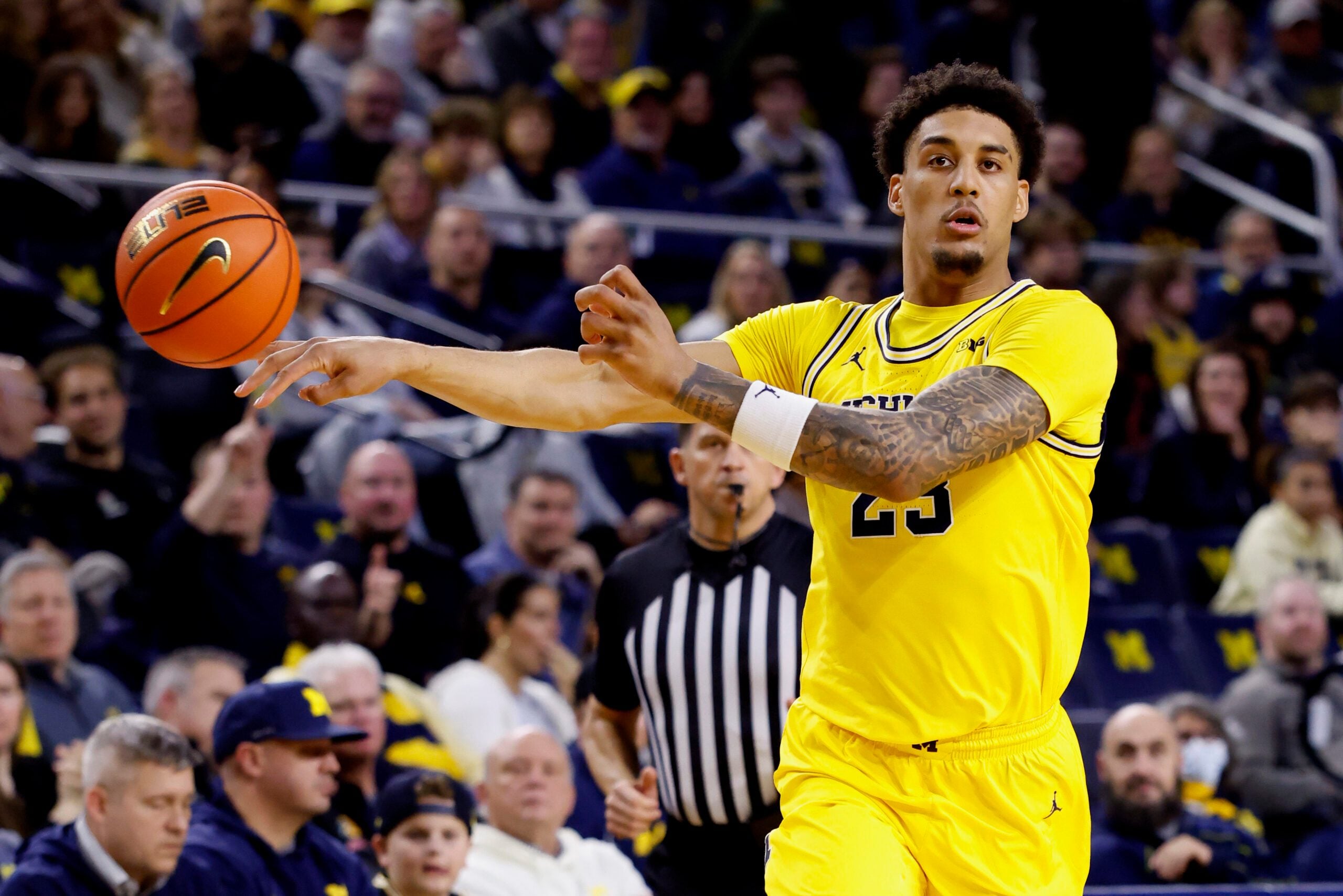 Dec 29, 2025; Ann Arbor, Michigan, USA;  Michigan Wolverines forward Yaxel Lendeborg (23) passes in the first half against the McNeese Cowboys at Crisler Center. Mandatory Credit: Rick Osentoski-Imagn Images