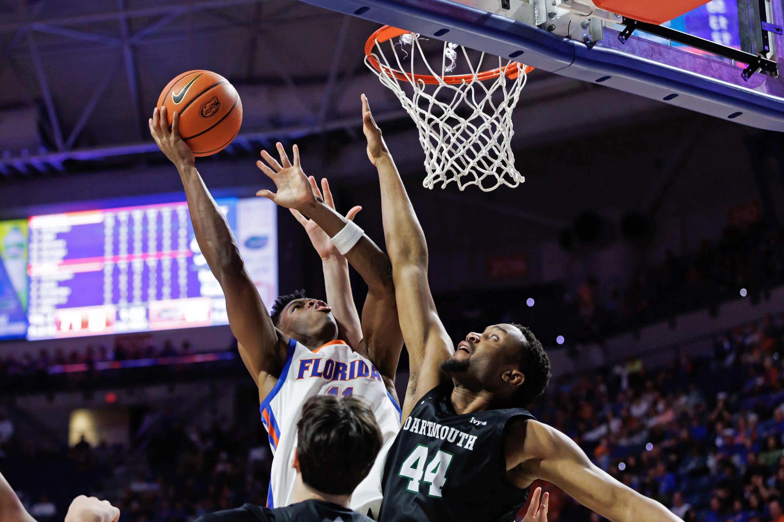 Dec 29, 2025; Gainesville, Florida, USA; Florida Gators guard CJ Ingram II (11) shoots over Dartmouth Big Green forward Shanon Simango (44) during the second half at Exactech Arena at the Stephen C. O'Connell Center. Mandatory Credit: Matt Pendleton-Imagn Images