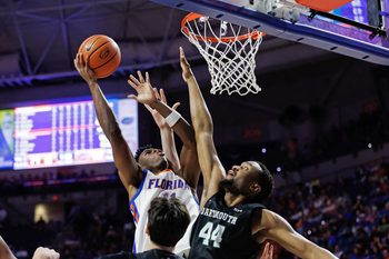 Dec 29, 2025; Gainesville, Florida, USA; Florida Gators guard CJ Ingram II (11) shoots over Dartmouth Big Green forward Shanon Simango (44) during the second half at Exactech Arena at the Stephen C. O'Connell Center. Mandatory Credit: Matt Pendleton-Imagn Images