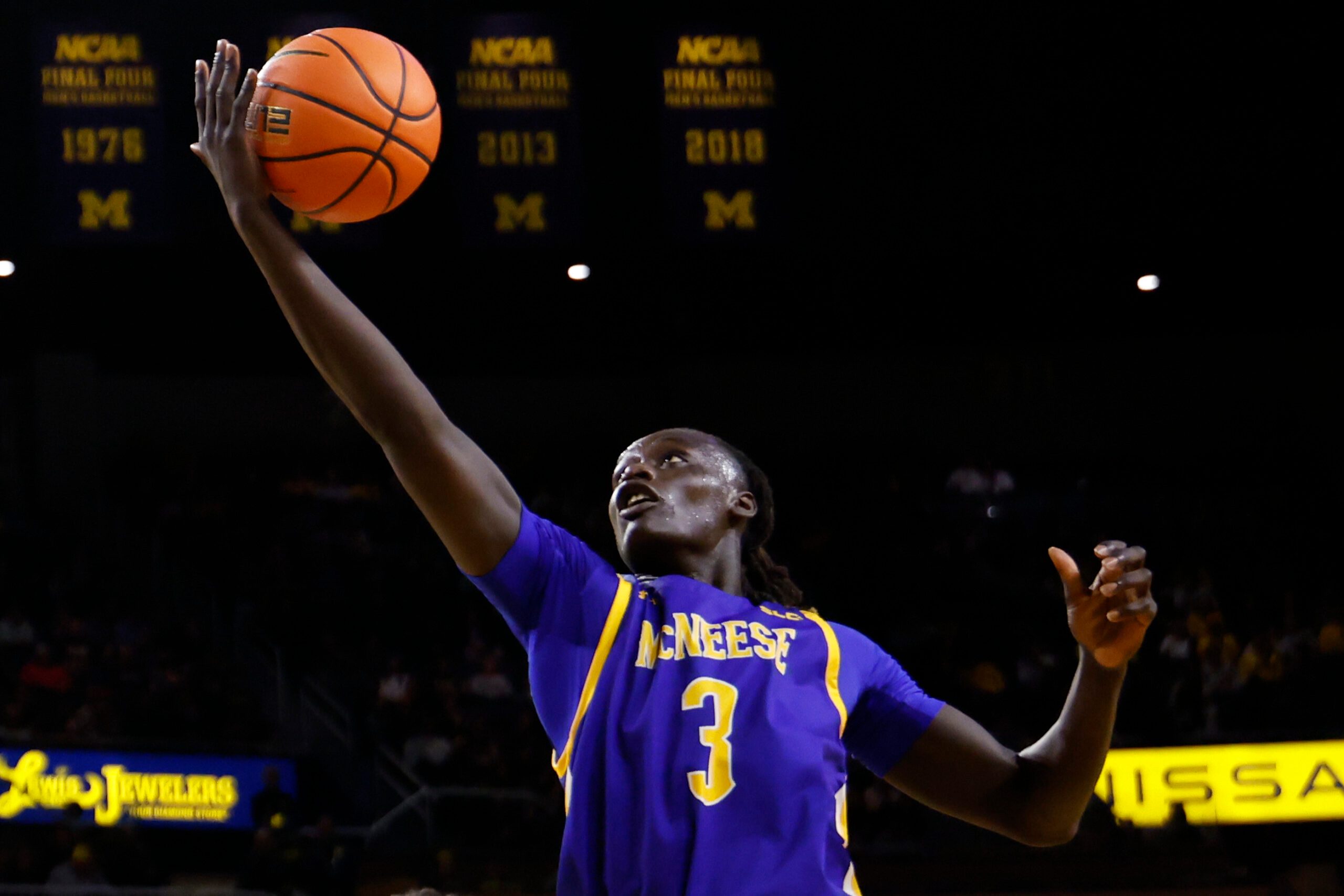 Dec 29, 2025; Ann Arbor, Michigan, USA;  McNeese Cowboys guard Garwey Dual (3) shoots in the second half against the Michigan Wolverines at Crisler Center. Mandatory Credit: Rick Osentoski-Imagn Images