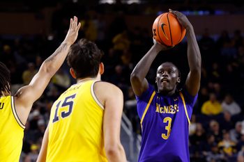 Dec 29, 2025; Ann Arbor, Michigan, USA;  McNeese Cowboys guard Garwey Dual (3) shoots in the second half against the Michigan Wolverines at Crisler Center. Mandatory Credit: Rick Osentoski-Imagn Images