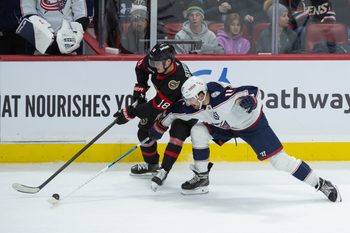 Dec 29, 2025; Ottawa, Ontario, CAN; Ottawa Senators center Tim Stutzle (18) battles with Columbus Blue Jackets left wing Miles Wood (11) for control of the puck in the third period at the Canadian Tire Centre. Mandatory Credit: Marc DesRosiers-IMAGN Images