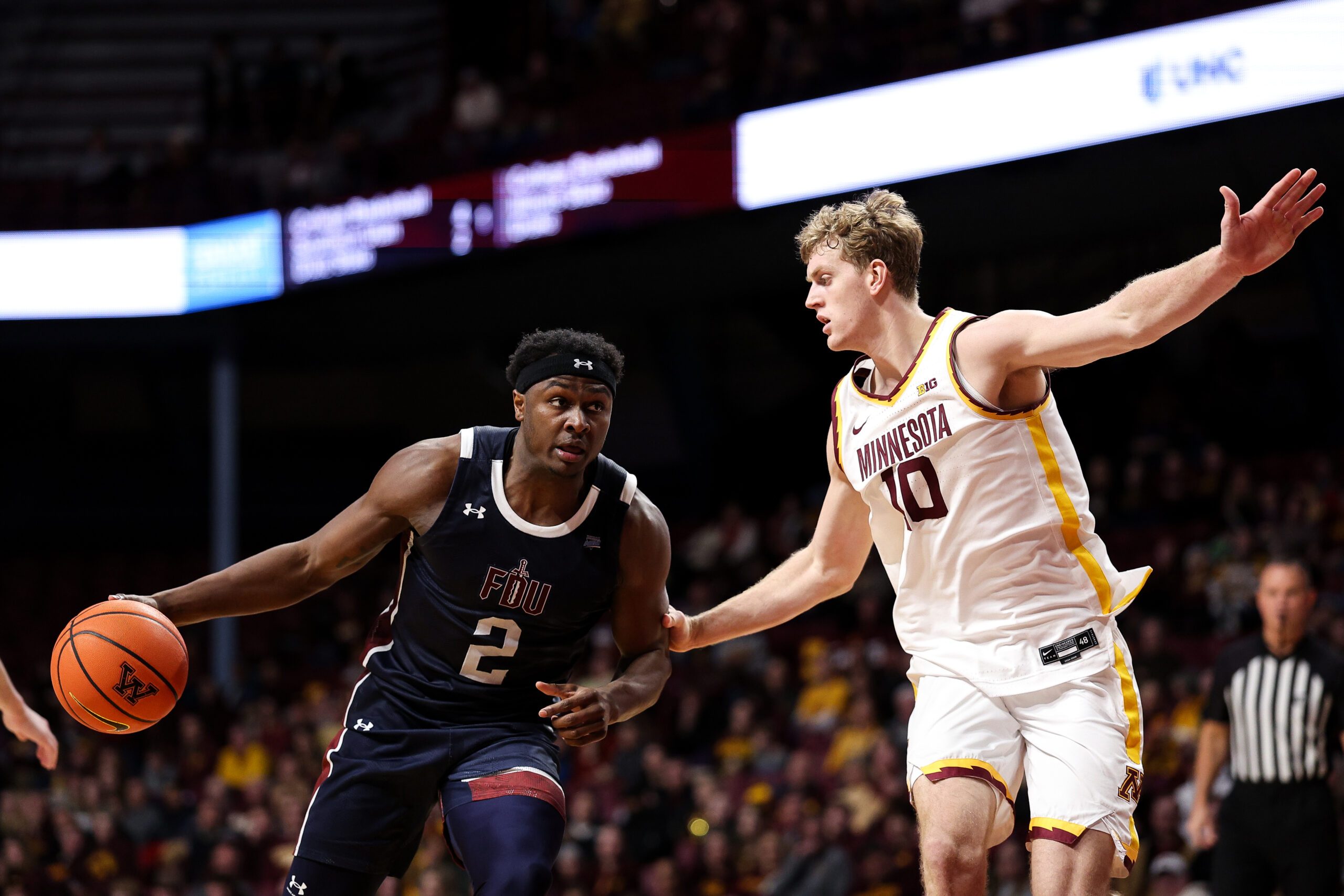 Dec 29, 2025; Minneapolis, Minnesota, USA; Fairleigh Dickinson Knights forward Taeshaud Jackson (2) works around Minnesota Golden Gophers forward Cade Tyson (10) during the second half at Williams Arena. Mandatory Credit: Matt Krohn-Imagn Images