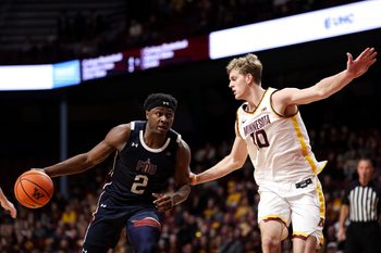 Dec 29, 2025; Minneapolis, Minnesota, USA; Fairleigh Dickinson Knights forward Taeshaud Jackson (2) works around Minnesota Golden Gophers forward Cade Tyson (10) during the second half at Williams Arena. Mandatory Credit: Matt Krohn-Imagn Images