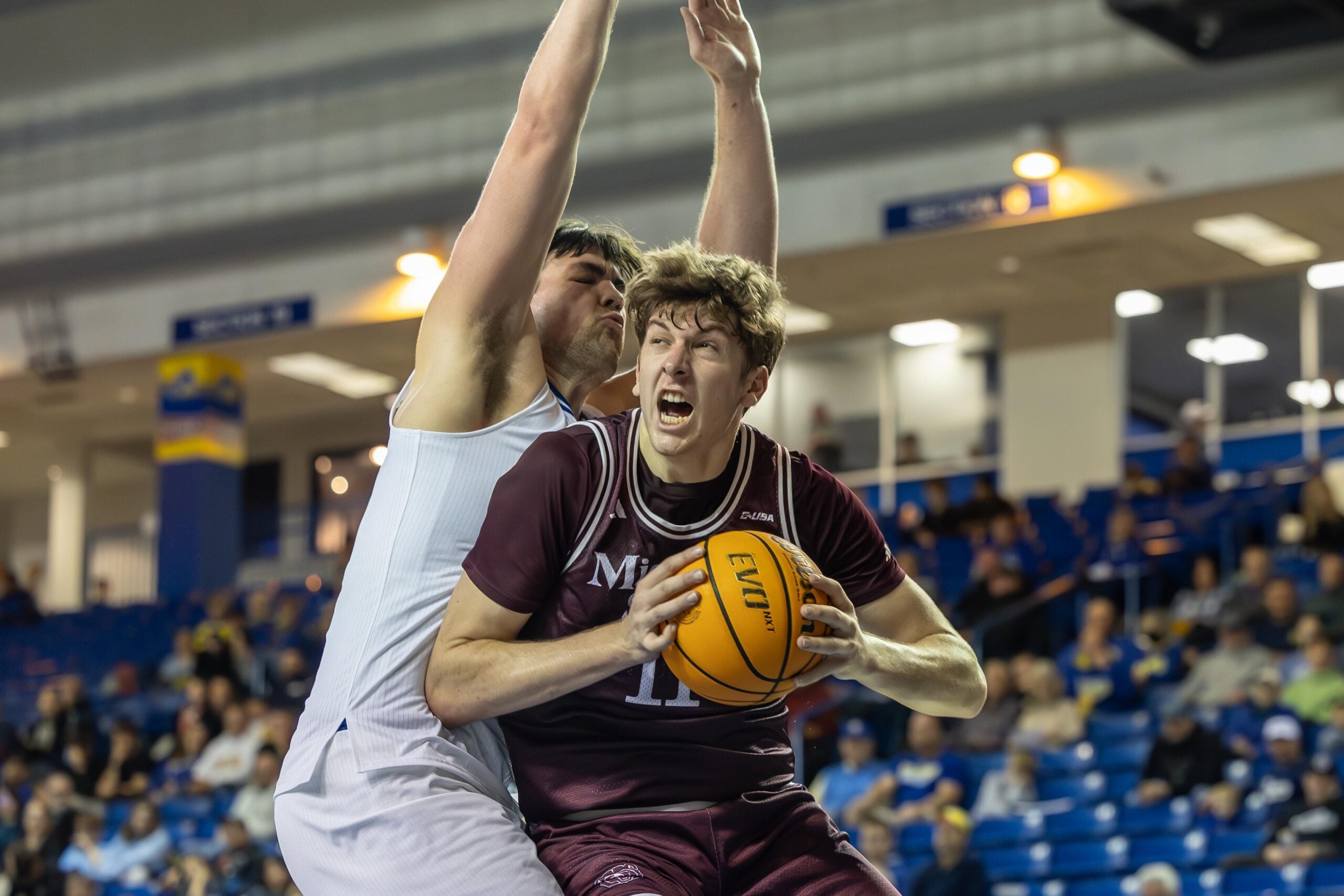 Missouri State Forward Keith Palek III (11) drives to the basket against Delaware Hens guard Justyn Fernandez (4) at The Bob Carpenter Center on Dec. 29, 2025.