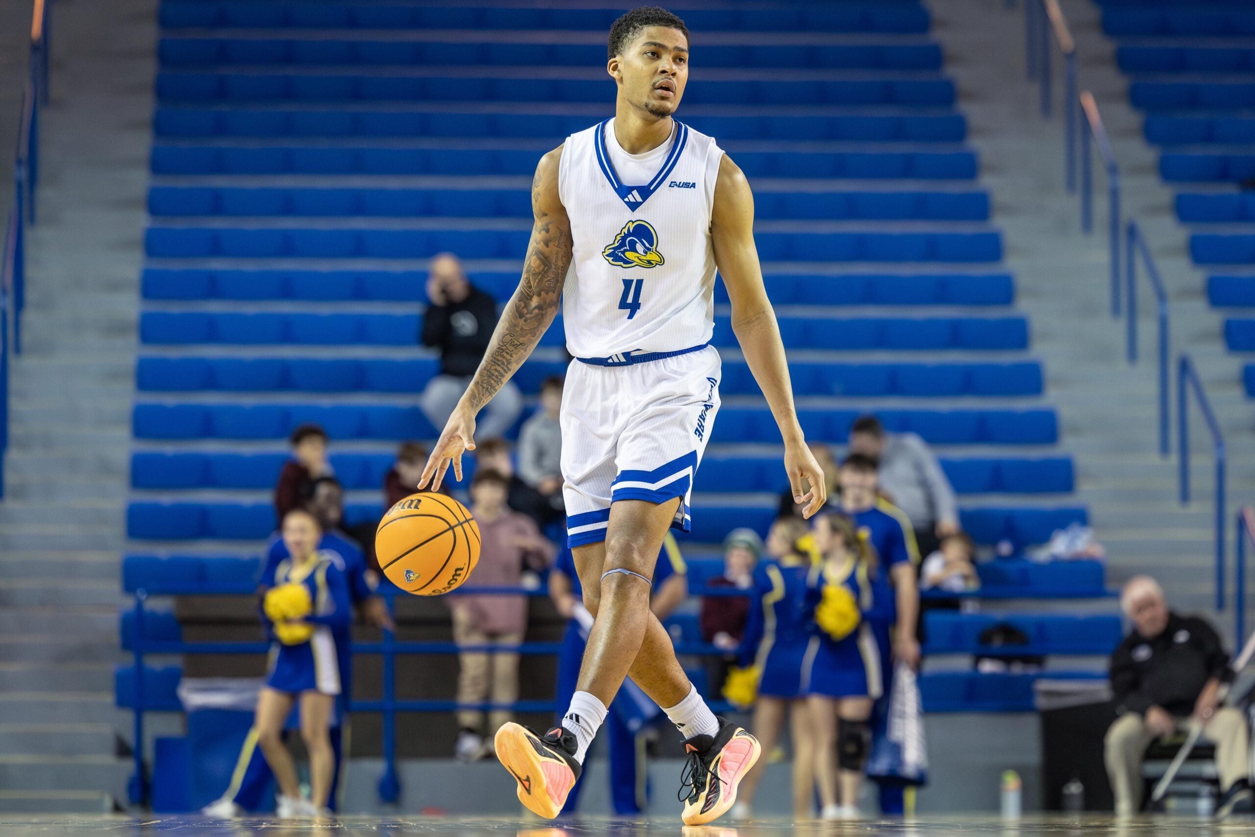 Delaware Hens guard Justyn Fernandez (4) dribbles the ball during the game against Missouri State at The Bob Carpenter Center on Dec. 29, 2025.