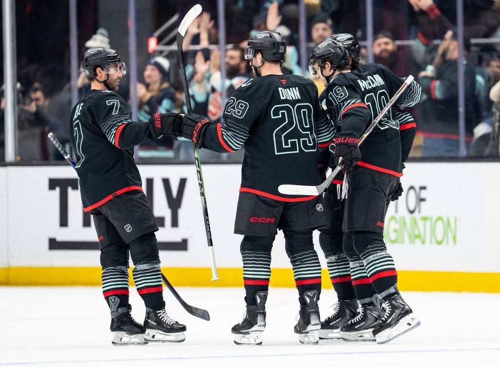 Dec 29, 2025; Seattle, Washington, USA; Seattle Kraken including forward Jordan Eberle (7), defenseman Vince Dunn (29) and forward Jared McCann (19) celebrate a goal during the first period against the Vancouver Canucks at Climate Pledge Arena. Mandatory Credit: Stephen Brashear-Imagn Images
