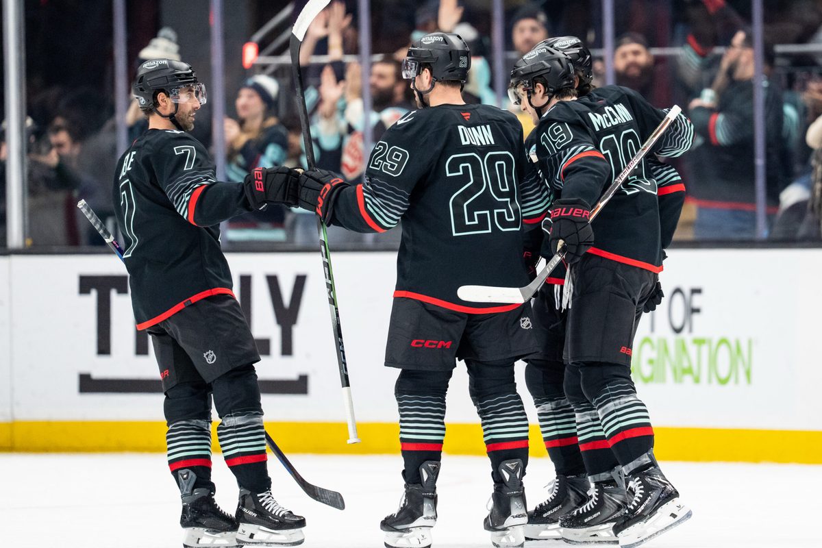 Dec 29, 2025; Seattle, Washington, USA; Seattle Kraken including forward Jordan Eberle (7), defenseman Vince Dunn (29) and forward Jared McCann (19) celebrate a goal during the first period against the Vancouver Canucks at Climate Pledge Arena. Mandatory Credit: Stephen Brashear-Imagn Images