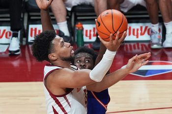 Iowa State Cyclones forward Joshua Jefferson (5) goes for a layup around Houston Christian Huskies forward Nehikhare Igiehon (7) during the second half in the NCAA men’s basketball on Dec. 29. 2025, at Hilton Coliseum in Ames, Iowa.