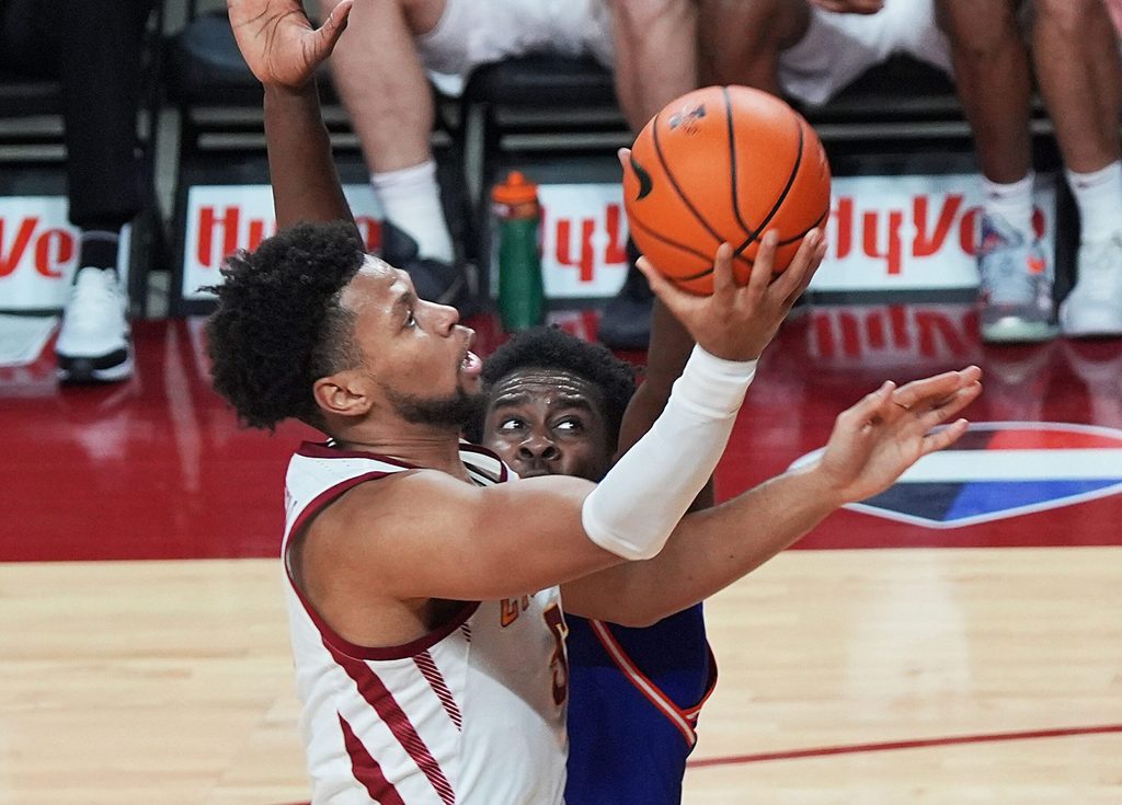 Iowa State Cyclones forward Joshua Jefferson (5) goes for a layup around Houston Christian Huskies forward Nehikhare Igiehon (7) during the second half in the NCAA men’s basketball on Dec. 29. 2025, at Hilton Coliseum in Ames, Iowa.