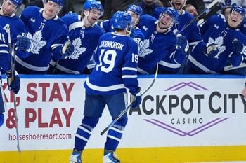 Dec 30, 2025; Toronto, Ontario, CAN; Toronto Maple Leafs center Calle Jarnkrok (19) celebrates at the bench after scoring a goal against the New Jersey Devils during the third period at Scotiabank Arena. Mandatory Credit: Nick Turchiaro-Imagn Images