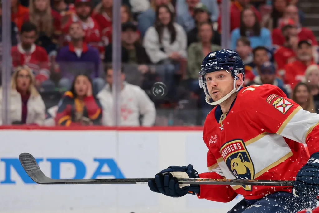 Dec 30, 2025; Sunrise, Florida, USA; Florida Panthers center Sam Reinhart (13) moves the puck against the Montreal Canadiens during the third period at Amerant Bank Arena. Mandatory Credit: Sam Navarro-Imagn Images