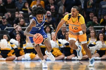 Seton Hall guard Tajuan Simpkins (2) steals the ball from Marquette guard Adrien Stevens (10) in the second half of a game Tuesday, December 30, 2025, at Fiserv Forum in Milwaukee, Wisconsin. Seton Hall won, 79-73.