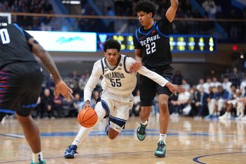 Dec 31, 2025; Villanova, Pennsylvania, USA; Villanova Wildcats guard Acaden Lewis (55) drives against DePaul Blue Demons guard Kruz McClure (22) in the first half at William B. Finneran Pavilion. Mandatory Credit: Kyle Ross-Imagn Images